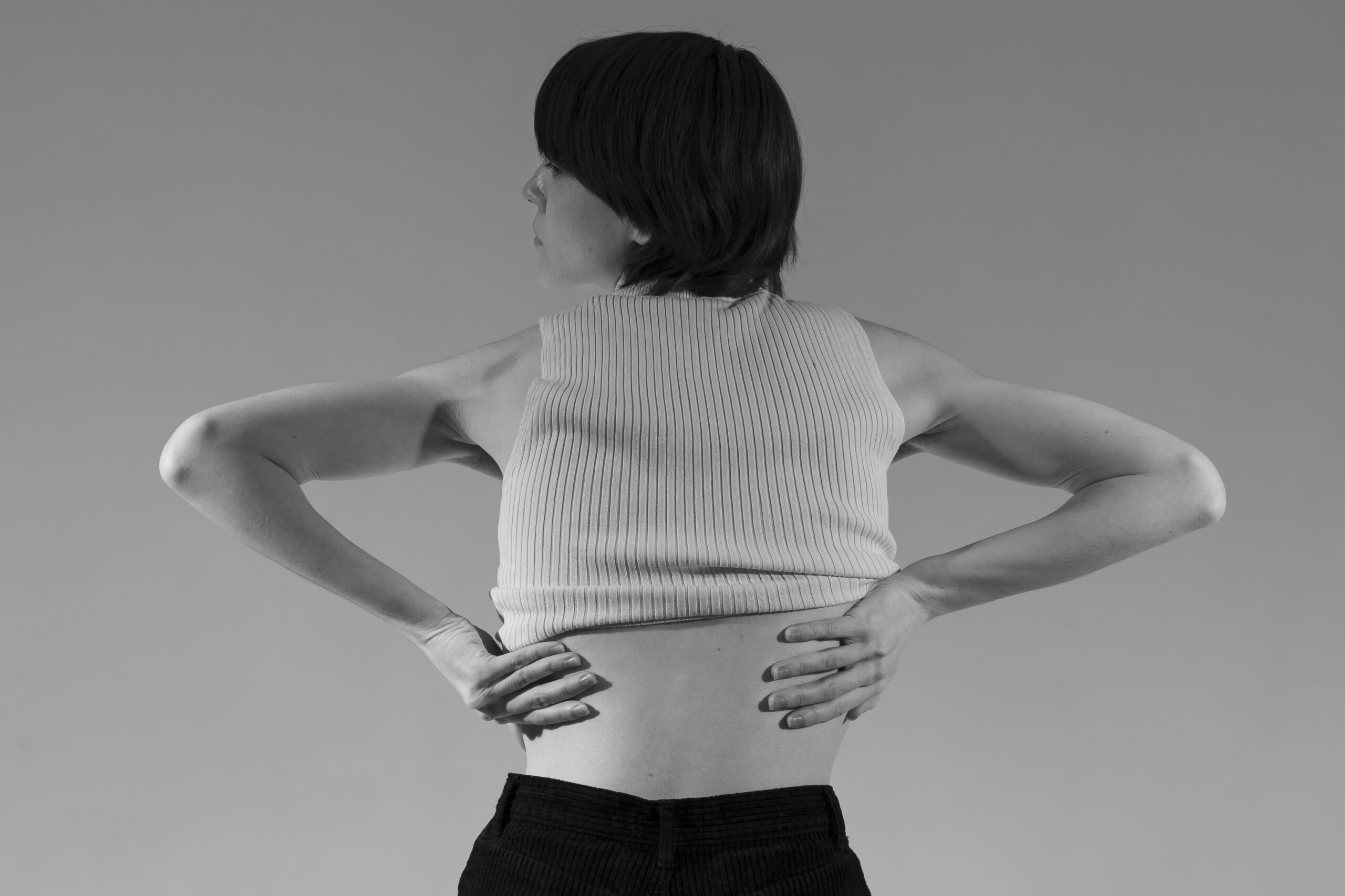 back-view-woman-getting-undressed