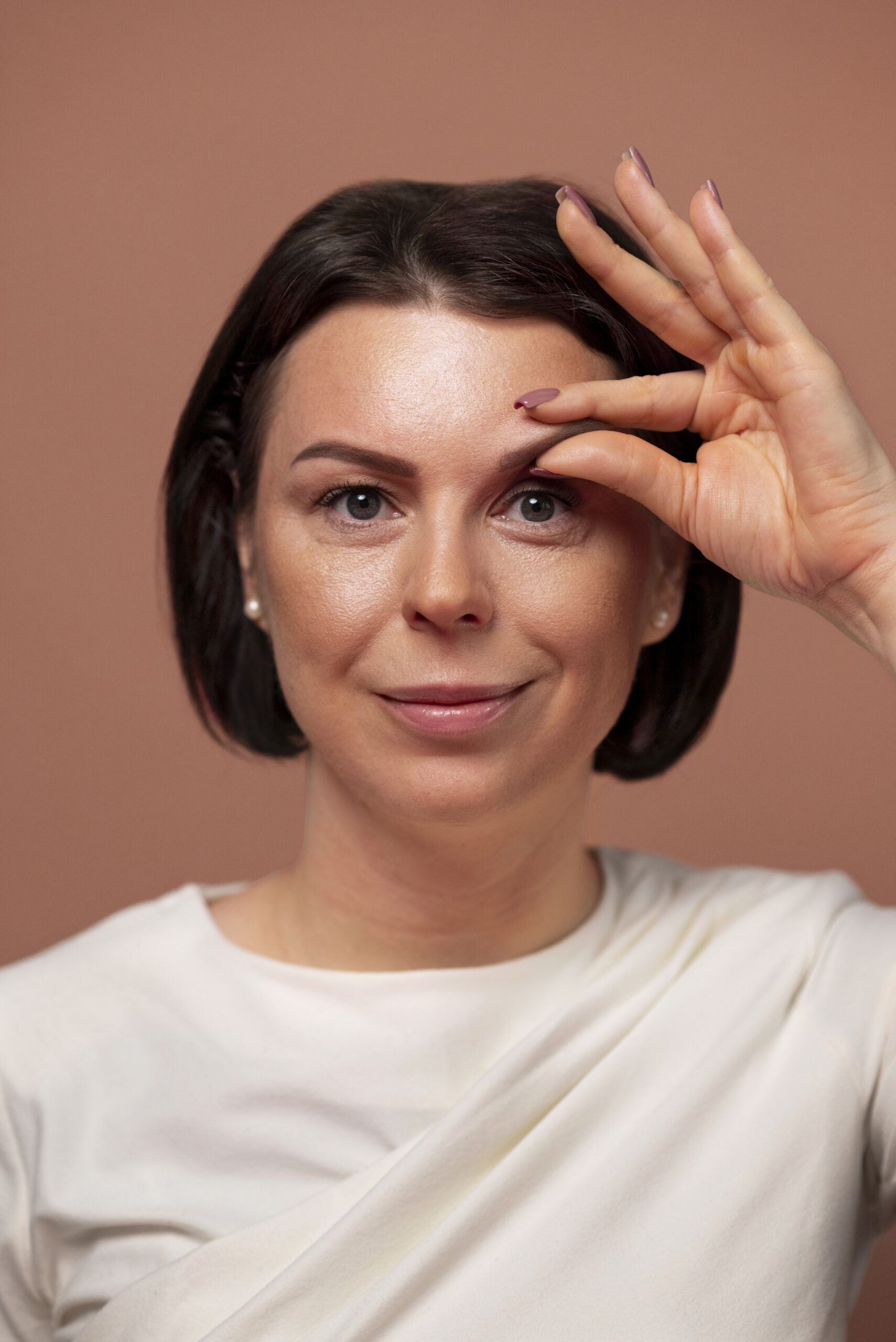 front-view-woman-practicing-facial-yoga