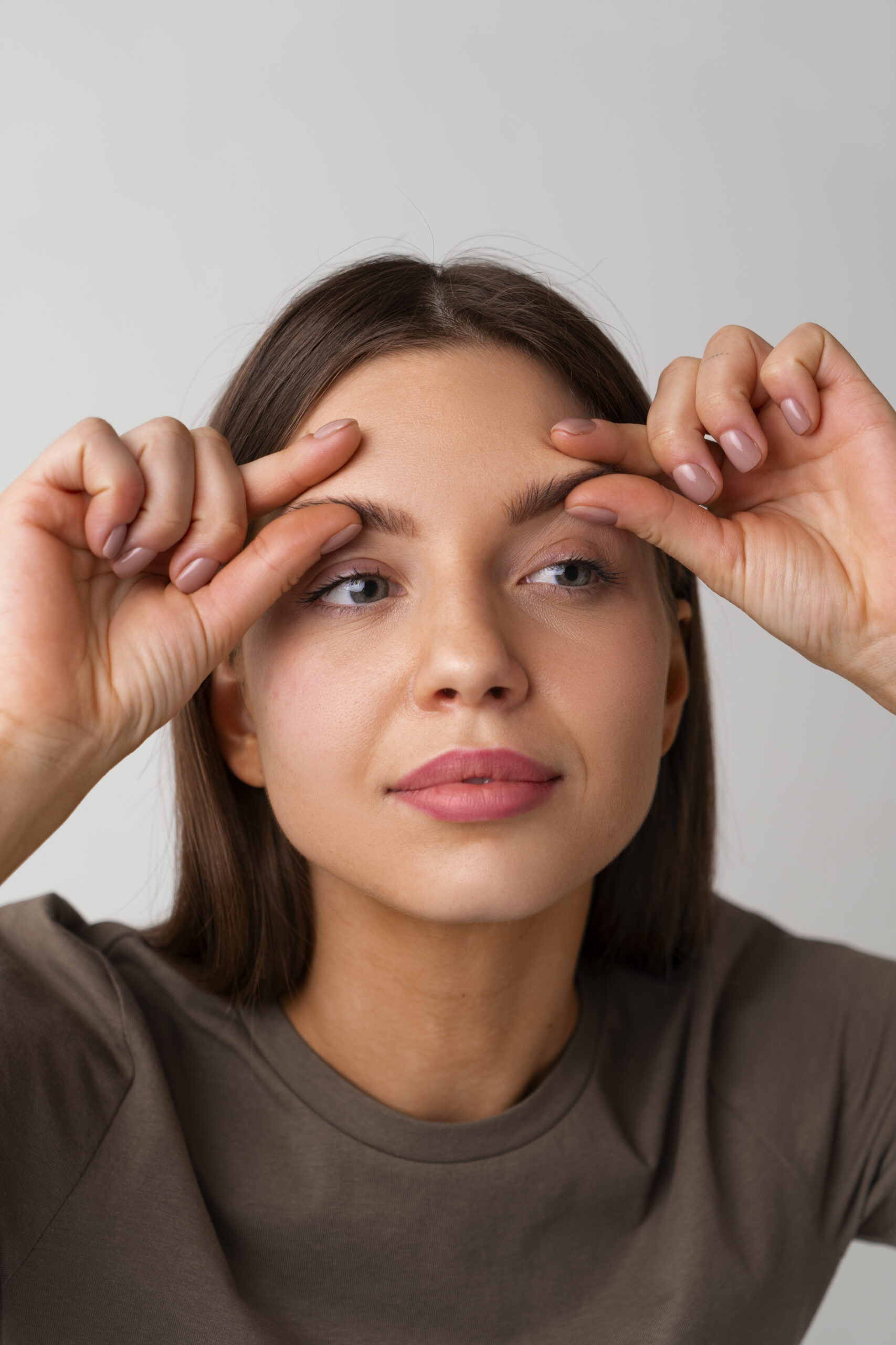 portrait-woman-trying-facial-yoga-massage-stay-young