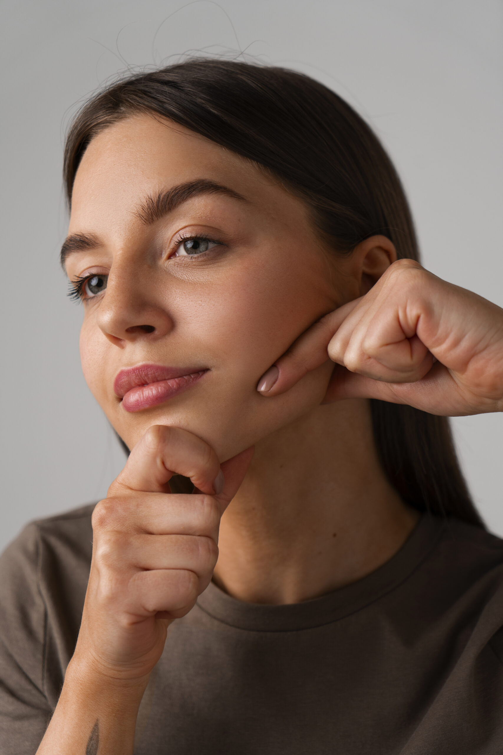 side-view-woman-practicing-facial-yoga
