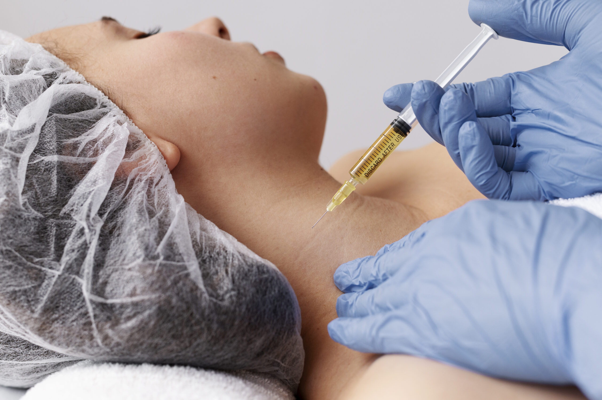 side-view-woman-getting-neck-prp-treatment